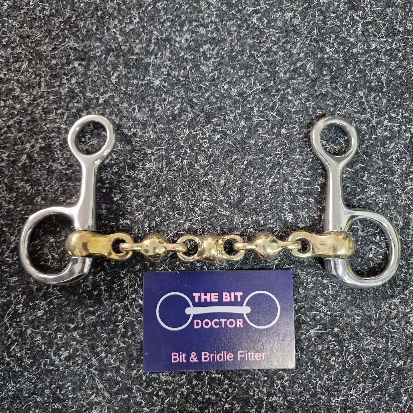 Hanging cheek copper waterford snaffle bit with neat short sides.